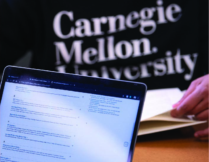 Image of CMU students using laptop.