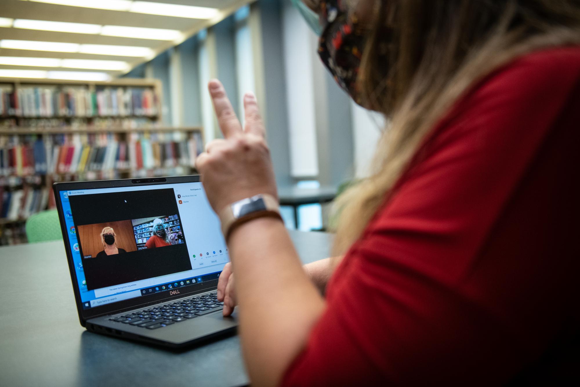Image of students using Zoom to interact at the library.