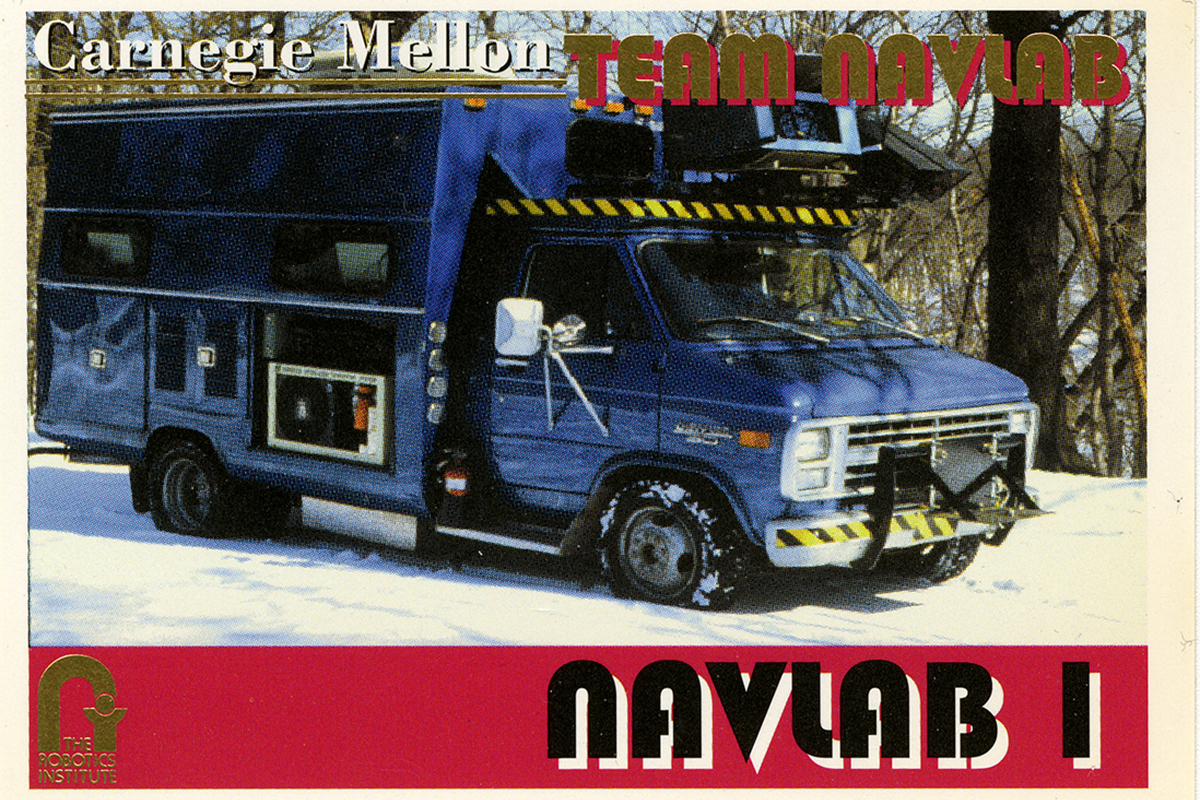 The front view of one of a series of trading cards produced for the various Navlab vehicles, in this case Navlab 1, a modified blue Chevy box truck. From the Daniel P. Siewiorek Papers, Carnegie Mellon University Archives.