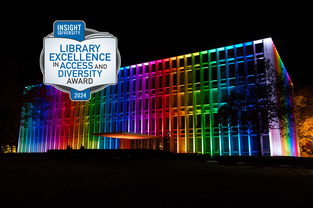 Hunt Library at night with Insight into Diversity award logo