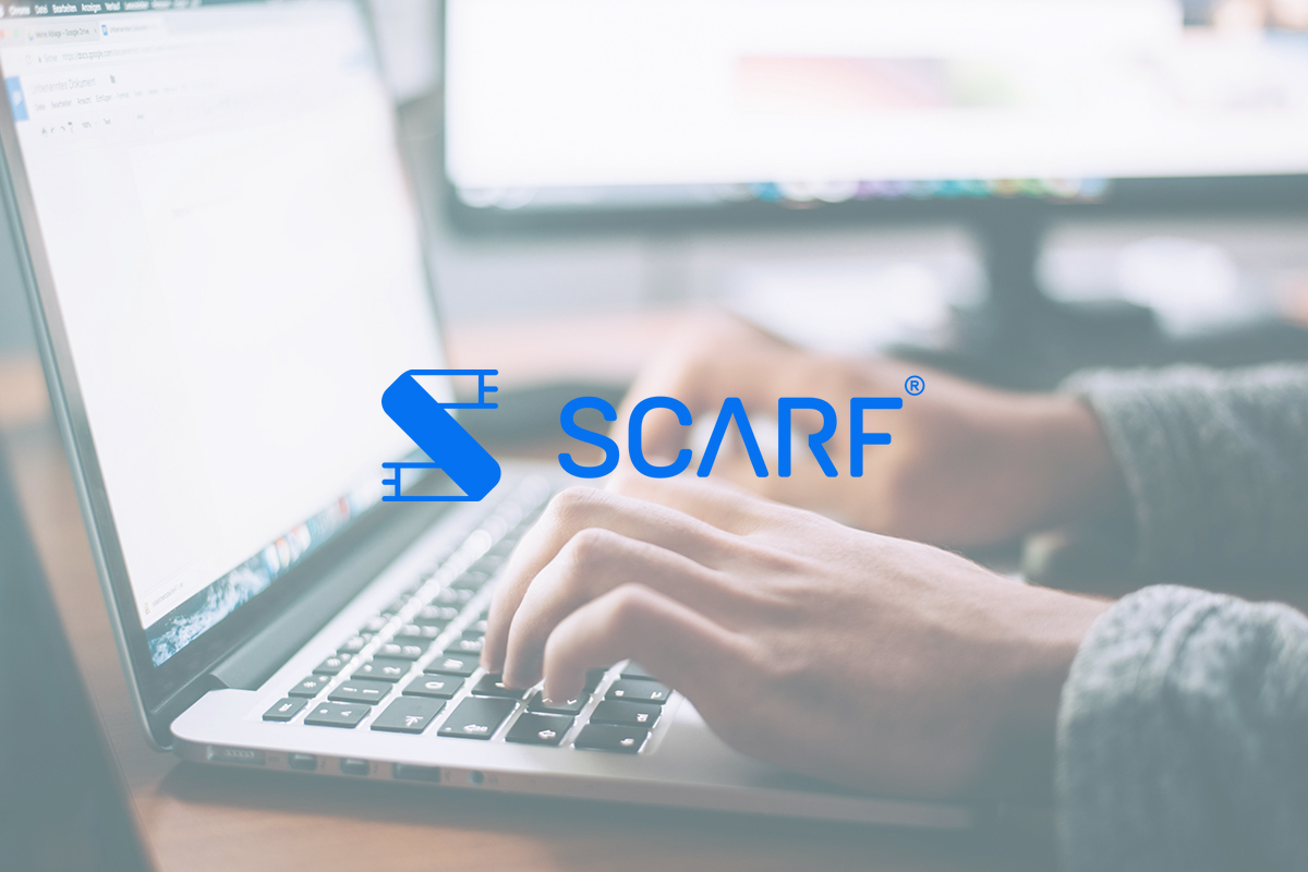 Scarf logo over laptop user