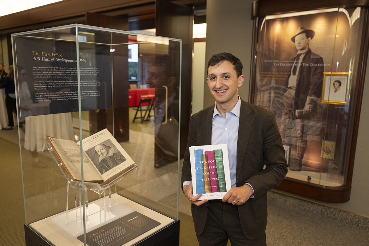 Sam Lemley holding a copy of “The Four Shakespeare Folios, 1623–2023: Copy, Print, Paper, Type”