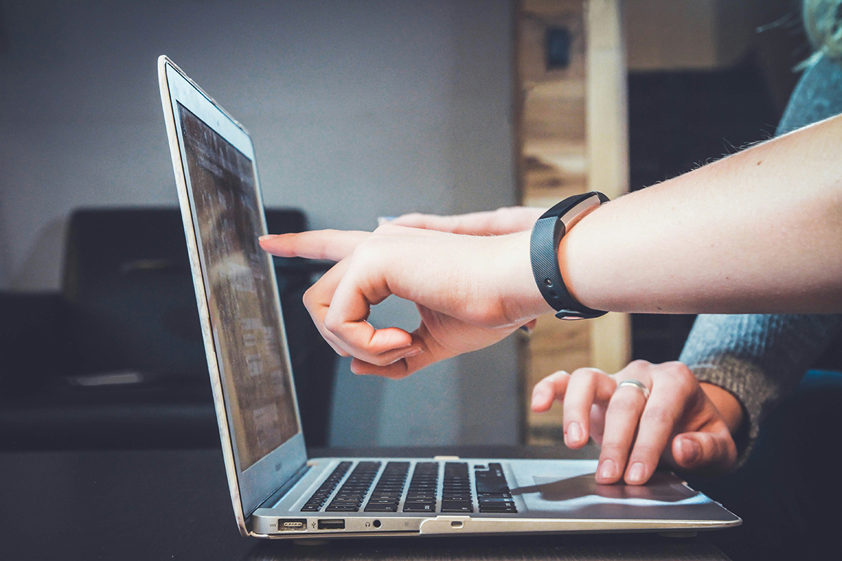 two people at a laptop