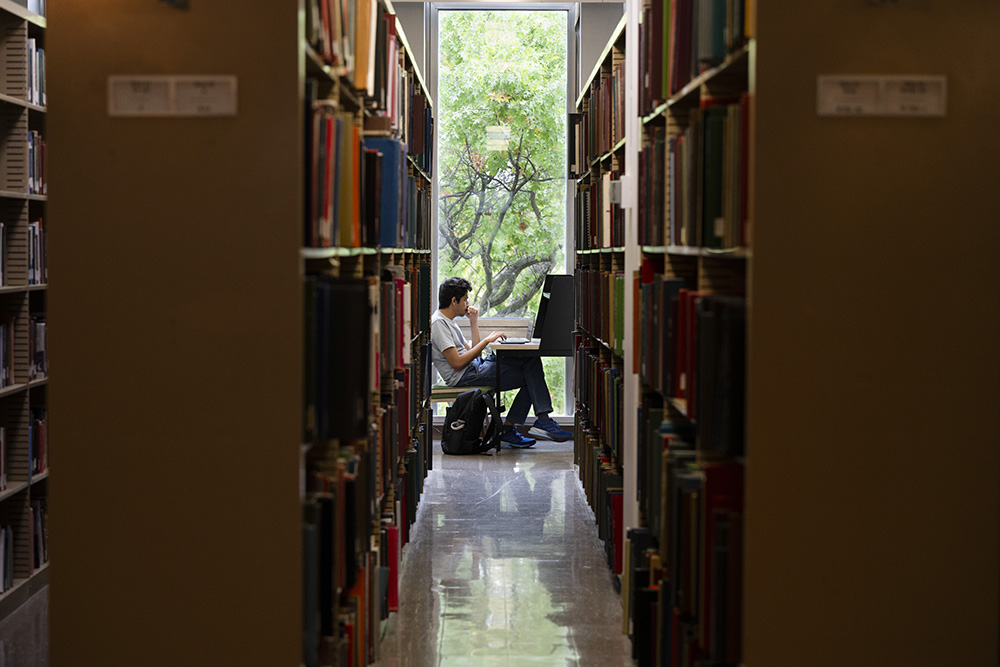 student in library