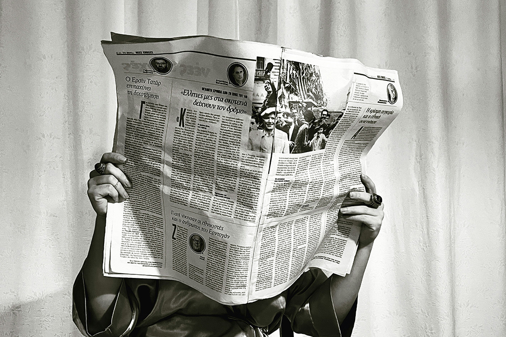 Person reading a newspaper