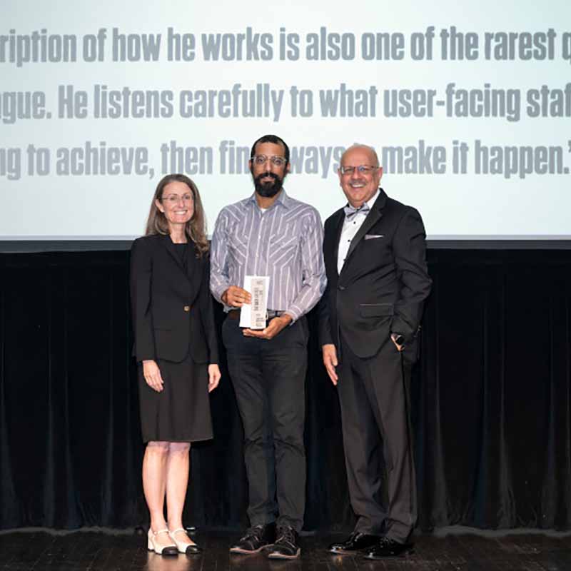 Jonathan Kiritharan with Vice President for Research Theresa Mayer (left) and CMU President Farnam Jahanian (right).