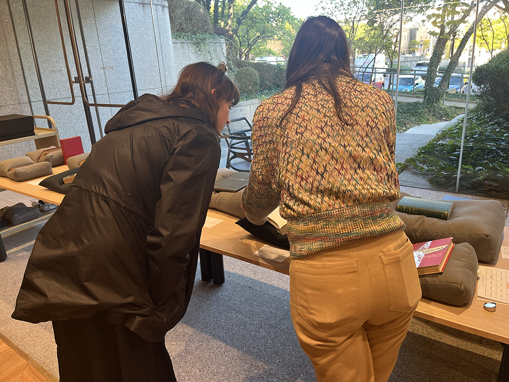 One visitor examines the banned books on display with Special Collections Coordinator Catherine Blauvelt.
