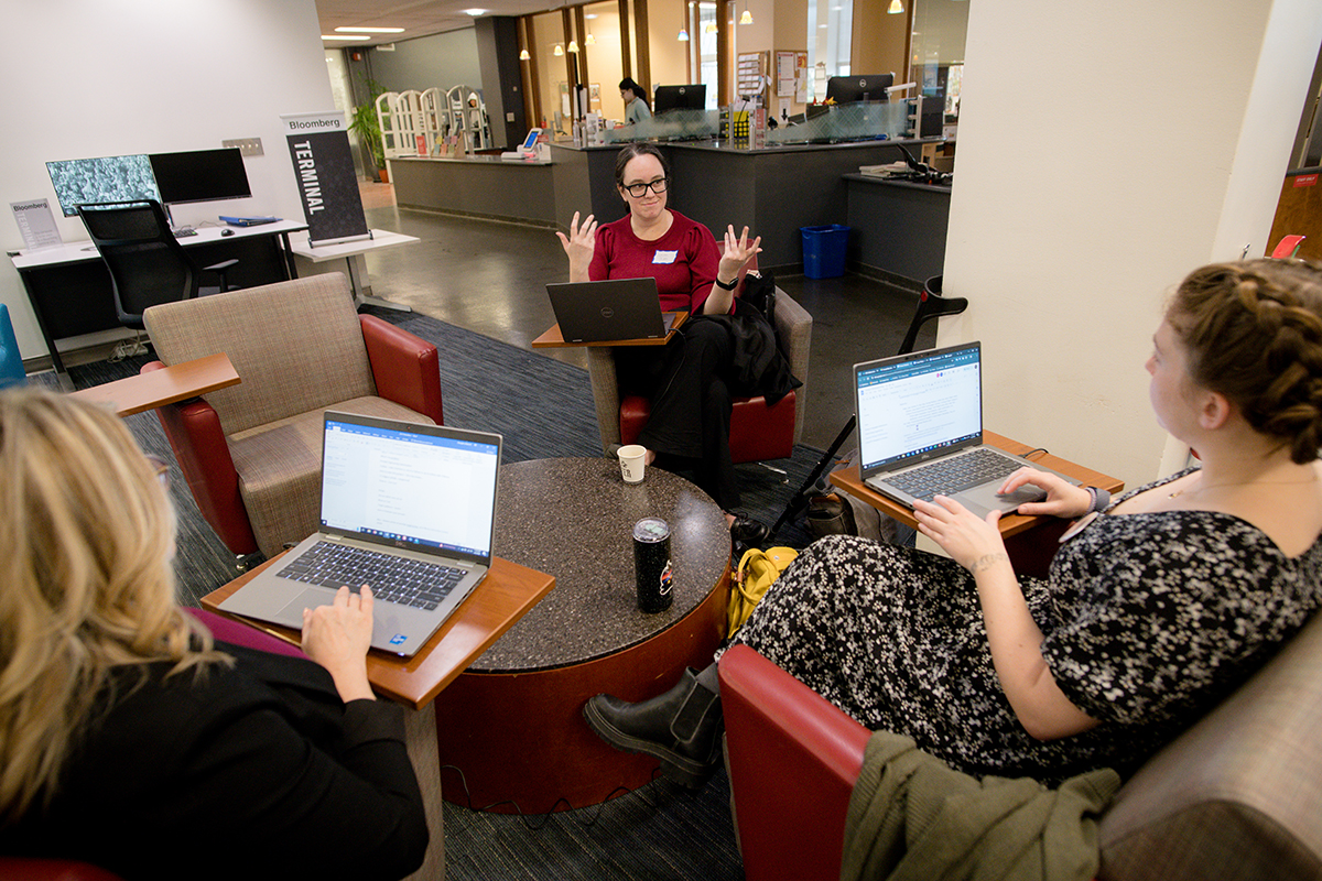 Kristin Scotti talks to students at the AI Literacy Hackathon