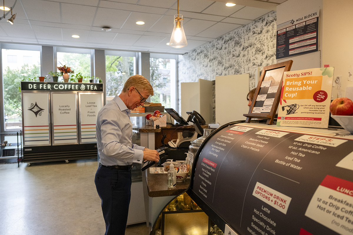 Keith Webster at De Fer Coffee. Photo by Rebecca Devereaux.