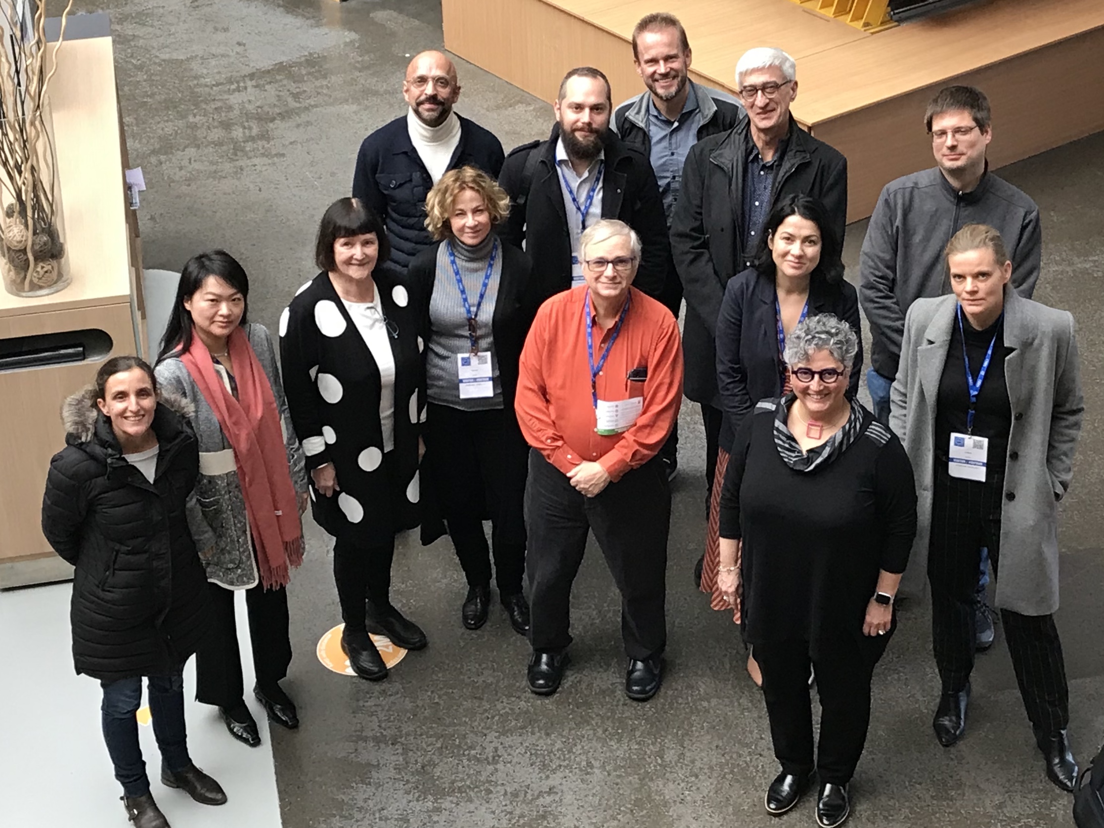 Marsteller surrounded by members of the SCOAP3 Executive Committee and the Second SCOAP3 Tender Working Group in Building 40 at CERN.