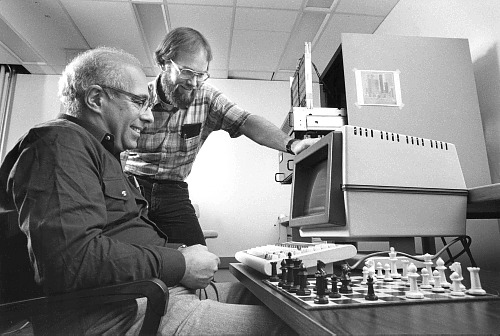 Computer Science Department faculty member and Grandmaster of Correspondence Chess Hans Berliner (left) and his student Carl Ebeling, who built HiTech.
