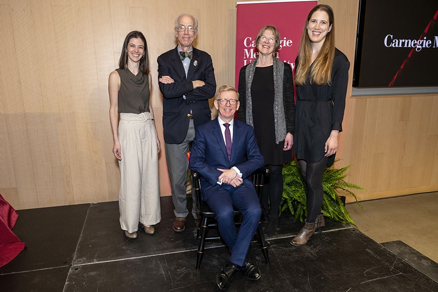 Keith Webster sits in his ceremonial chair with, from left: Anne Marie Toccket, the executive director of the Posner Foundation of Pittsburgh; Henry Posner III, chairman of Railroad Development Corporation (RDC); Anne Molloy, vice chair of the CMU Board of Trustees; and Ida Posner, vice president, strategic planning at RDC. 