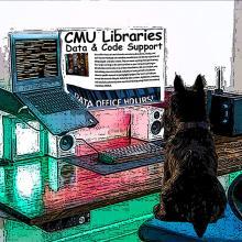 Scottish terrier sitting at a computer
